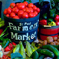 Photo of a bucket of tomatoes reading "St. Paul Farmers Market"