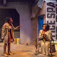 Photo of two students on stage in a play