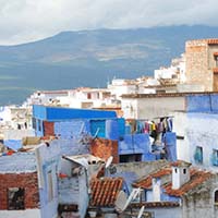 Photo of buildings and a mountain