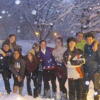 Photo of a group of students smiling in snow