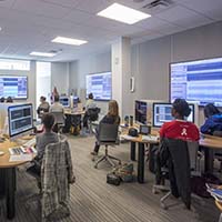 Photo of students working in an editing lab