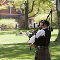 Photo of a man playing bagpipes