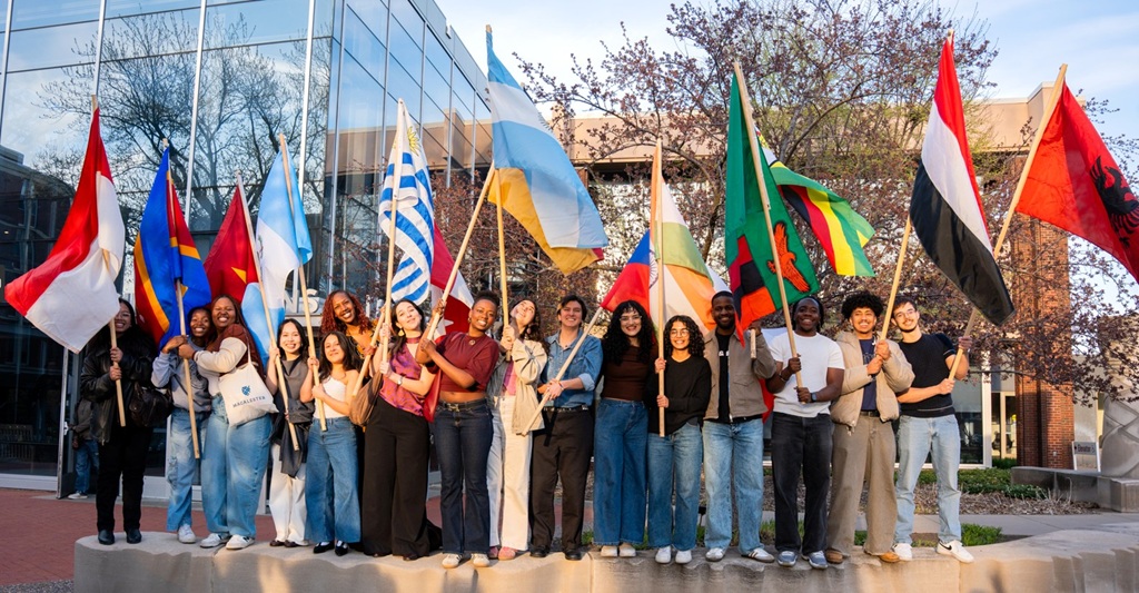 Mac students/UWC Alum with flags photo