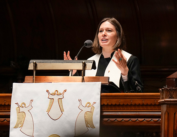 Natalie Owens-Pike preaches from a lectern