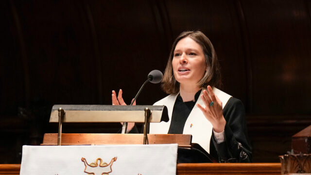 Natalie Owens-Pike preaches from a lectern