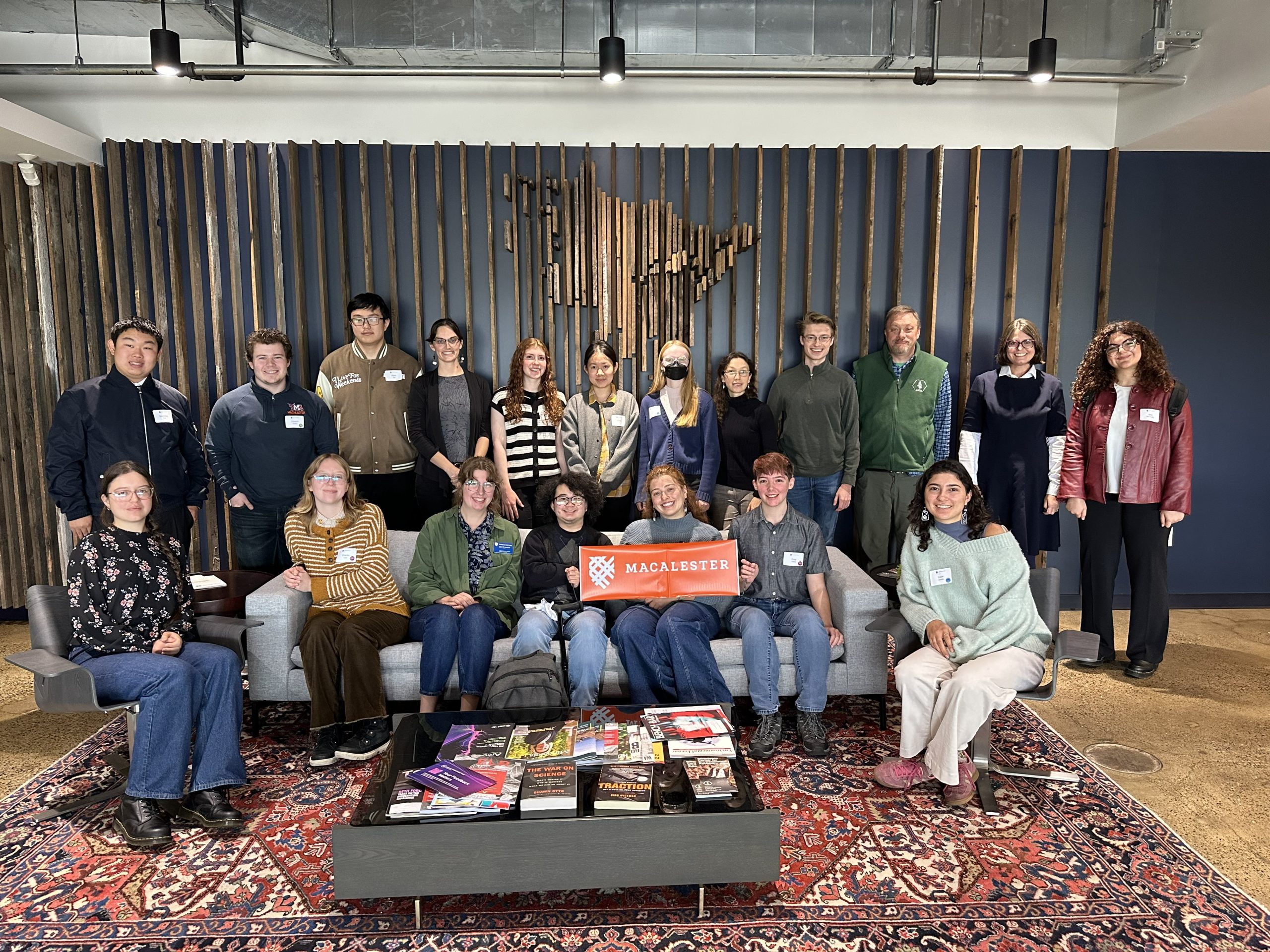 Group photo of students and staff at a MacExplore visit.