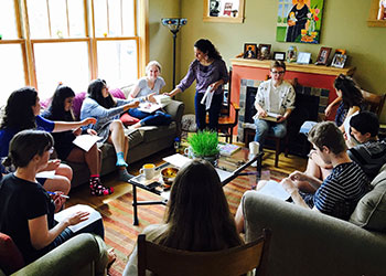 Students sitting in a circle in couches