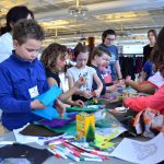Photo of children creating crafts at a table at International Kidsfest.