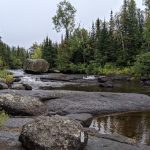 Photo showing a stream with large boulders in the Boundary Waters Canoe Area Wilderness