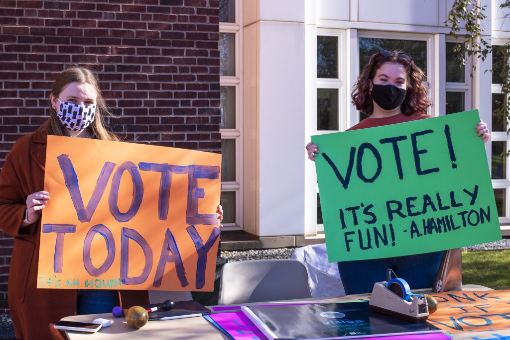 Students table on Election Day 2020 to encourage their peers to vote.