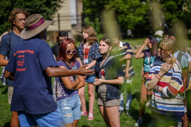 Students listening to a speaker at Dale Street Gardens