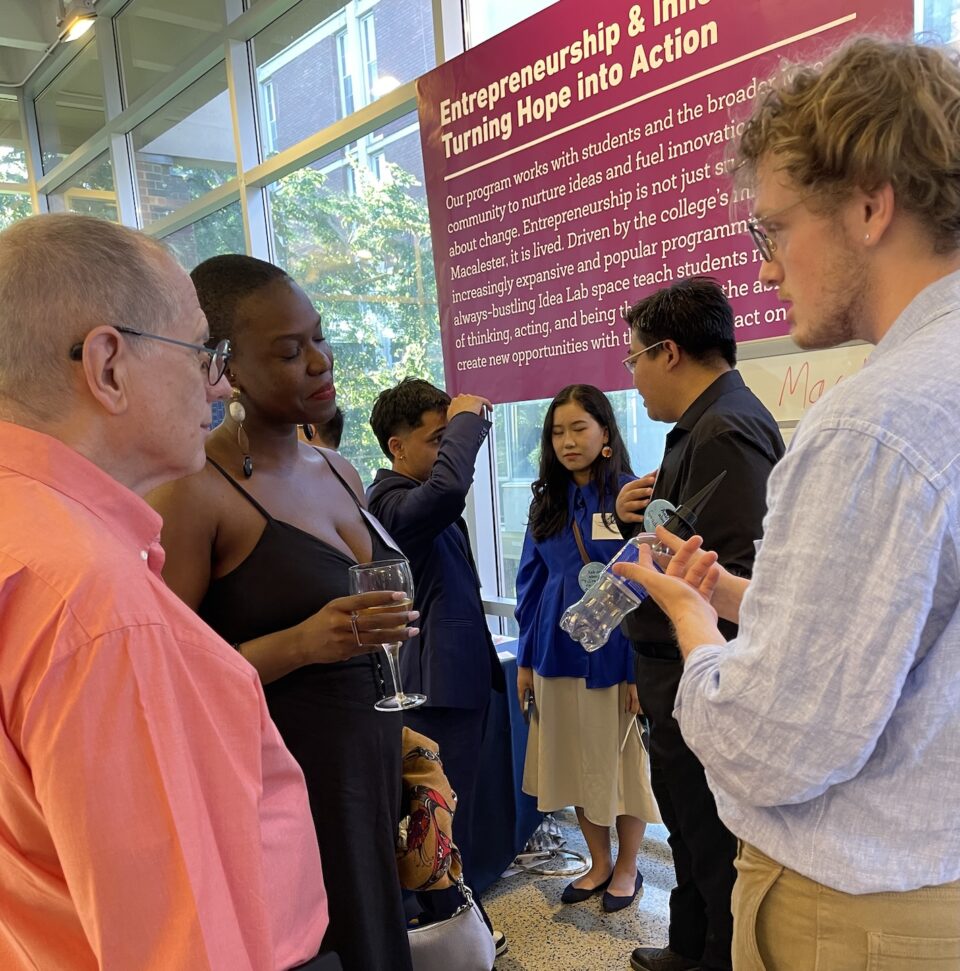 Group of student engaged in conversation with campus community