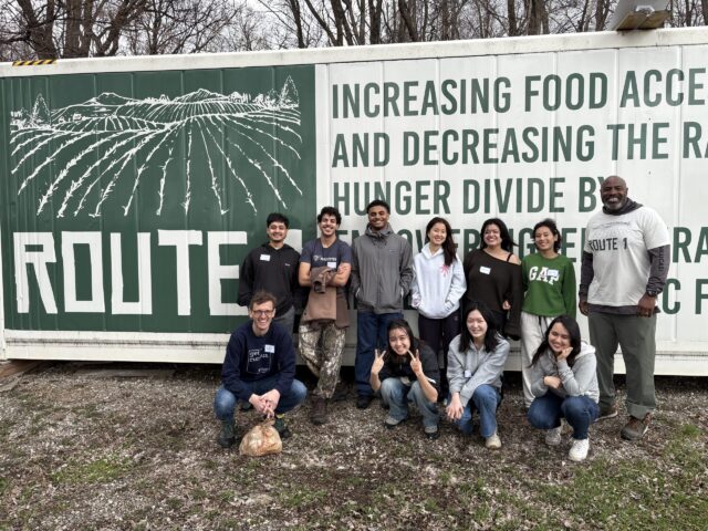 Group of students outside the freight farm at Route 1