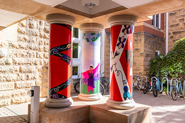 Three pillars outside DeWitt Wallace Library