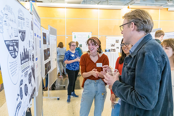 Student presents a research poster
