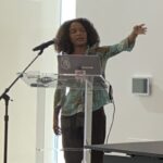 Photo of scholar Muriel Ambrus presenting in Chicago.