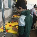 Photo showing student cooking at YouthFarm