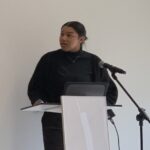 photo of scholar AJ Papakee presenting in Chicago.