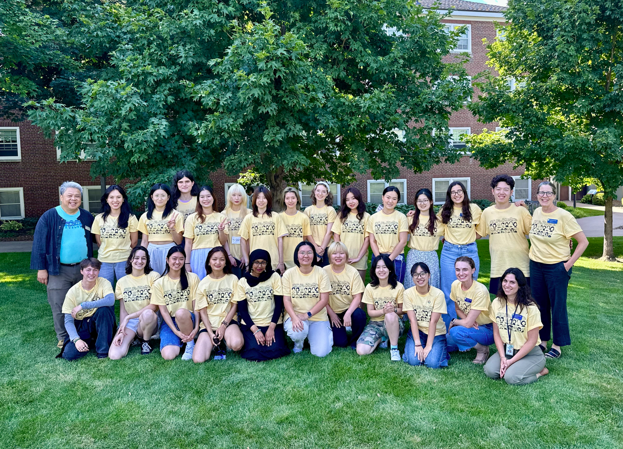 2025 mentors in matching yellow t-shirts smiling for the camera