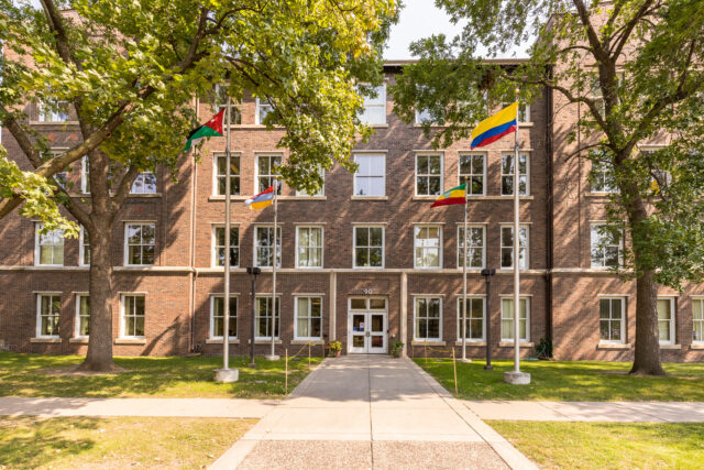 Macalester building with flags in the front