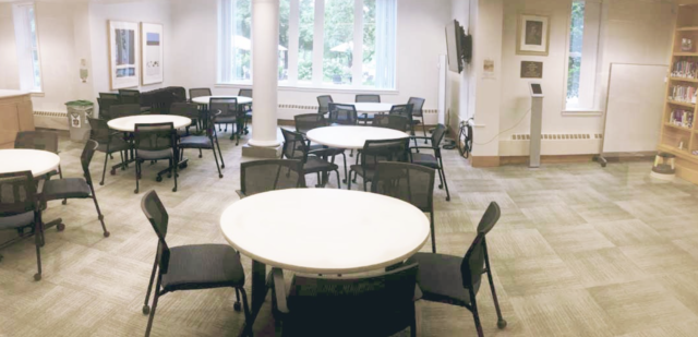 Harmon room in library, 6 circular tables with chairs