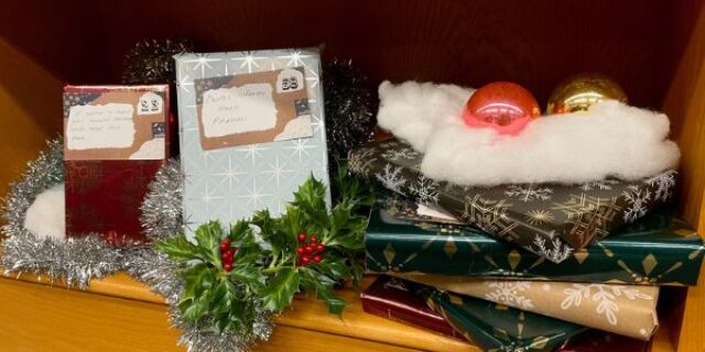 winter deocrations and holiday gift wrapped books