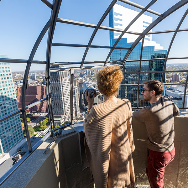 Students looking at Downtown Minneapolis from an observation deck.