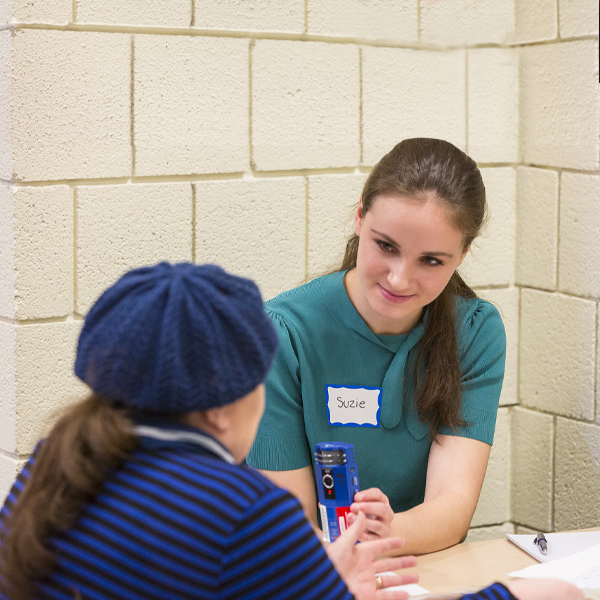 Macalester student interviewing a Rondo resident.