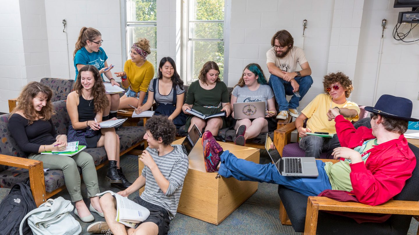Students gathered in a common room in a residence hall.