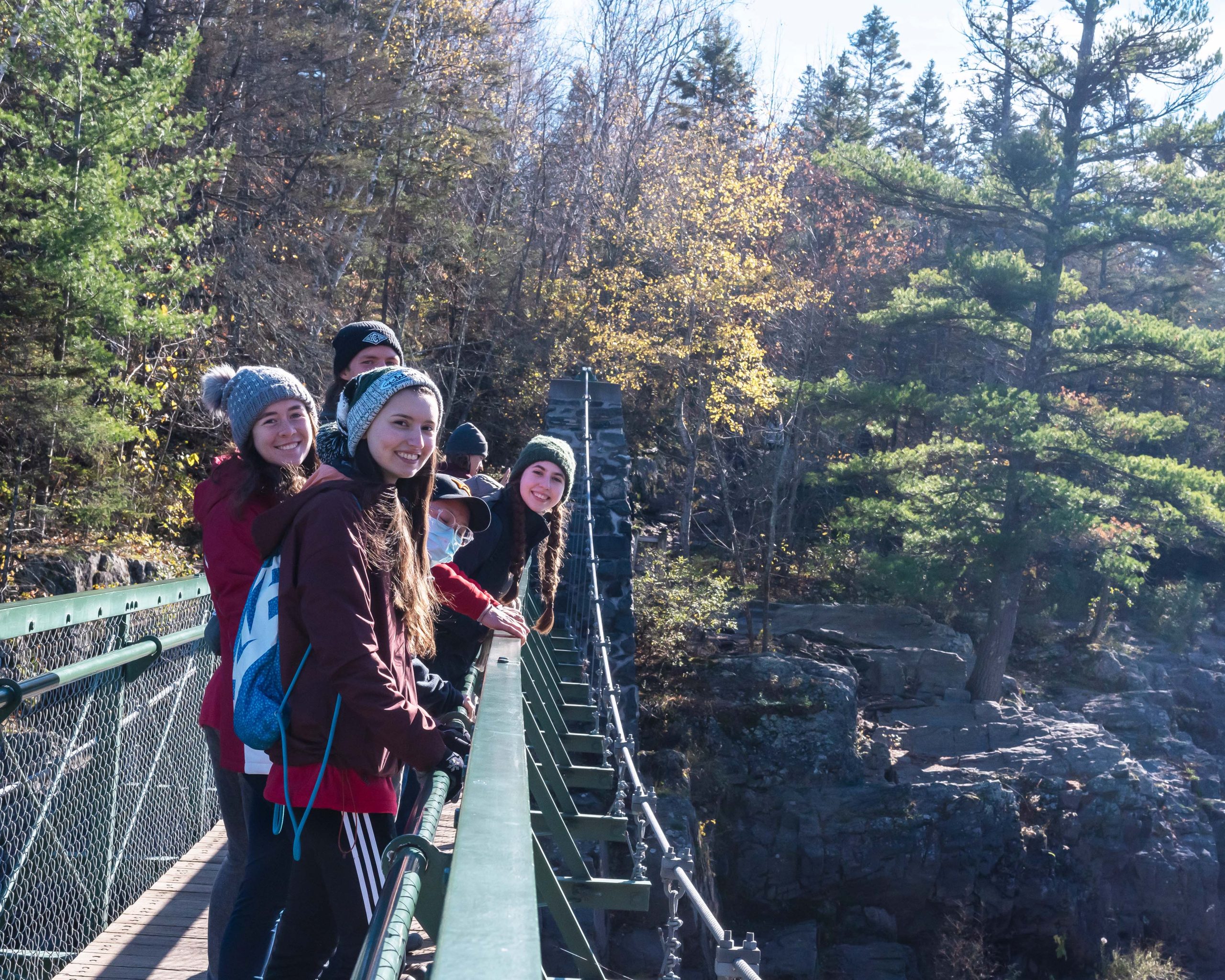 Five members of the Macalester Outing Club on trip to a Minnesota state park.