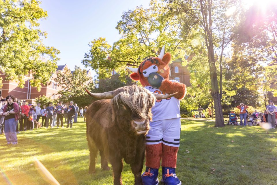 Mascots head from behind facing Leonard Center