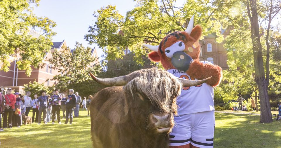 Mascots head from behind facing Leonard Center