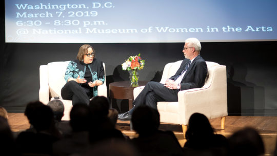 Photo of President Brian Rosenberg talking to Professor Duchess Harris