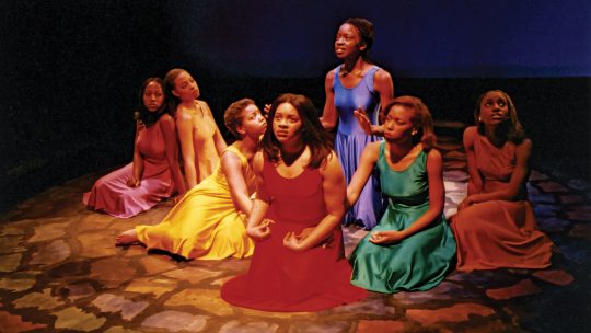 Photo of Macalester students acting in a play