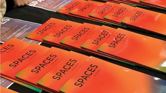 Photo of stacks of Spaces literary magazines