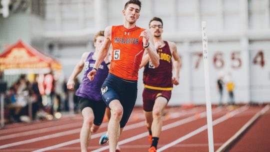 Photo of David Palmer and two non-Macalester athletes running