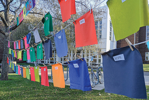 Photo of a clothesline with pieces of fabric clipped to it