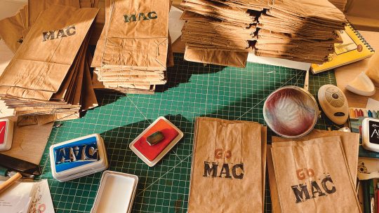 Photo of paper bags stamped with GO MAC