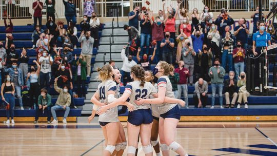 Volleyball team celebrates a win