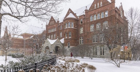 A snowy view of Old Main on the Macalester College campus.