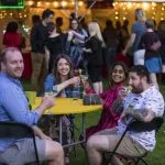 Four alumni sitting at a table