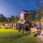 Alumni gathered on campus at night
