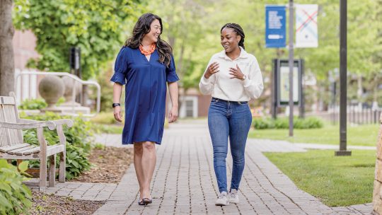 Dr. Kathryn Kay Coquemont and Jordanella Maluka walking together