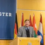 Phil Geier speaking at a podium