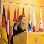 A student speaking at a microphone