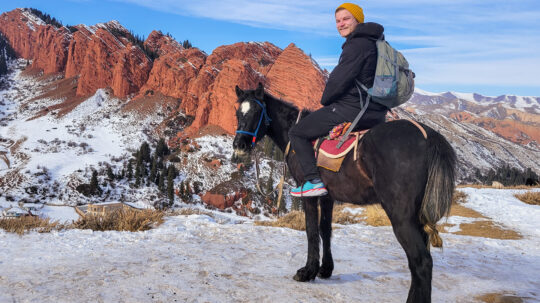 Dan rides a horse in Issyk Kul.