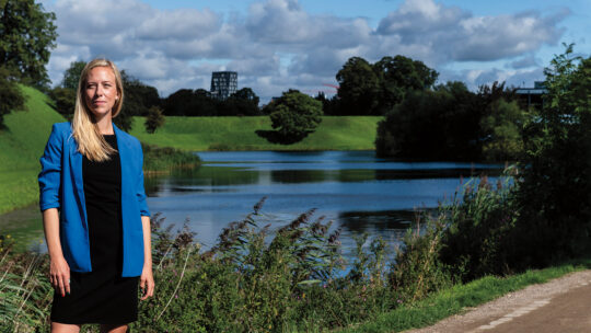 Nina Porst is pictured in front of a park and pond in Denmark