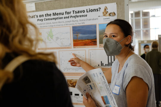 A student (Eliza King) presents their research on lion prey and predation habits.