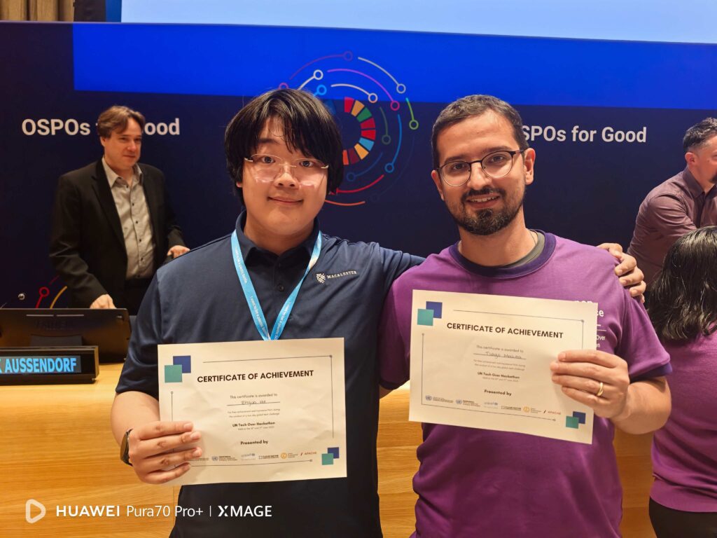 Macalester’s Zhijun He ’26 celebrates winning the UN Tech Over Hackathon with teammates.