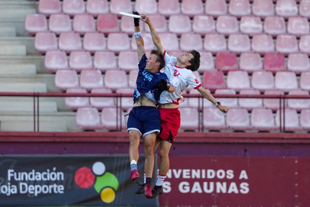 Macalester’s Kyle Suelflow ’26 leaps for the disc playing with Team USA Ultimate.